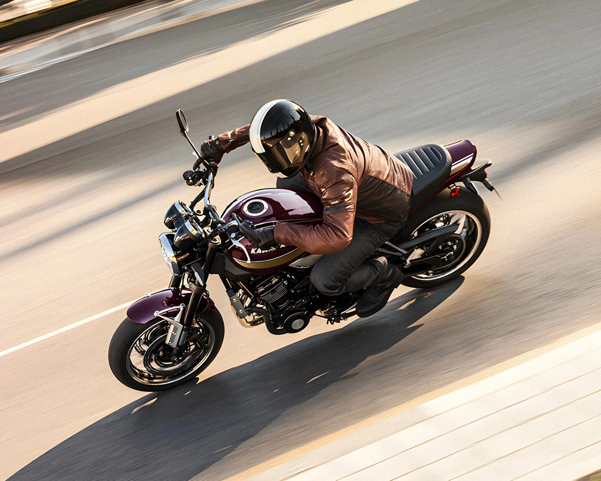 Person wearing a brown jacket and black helmet riding a maroon Kawasaki motorcycle on a road.