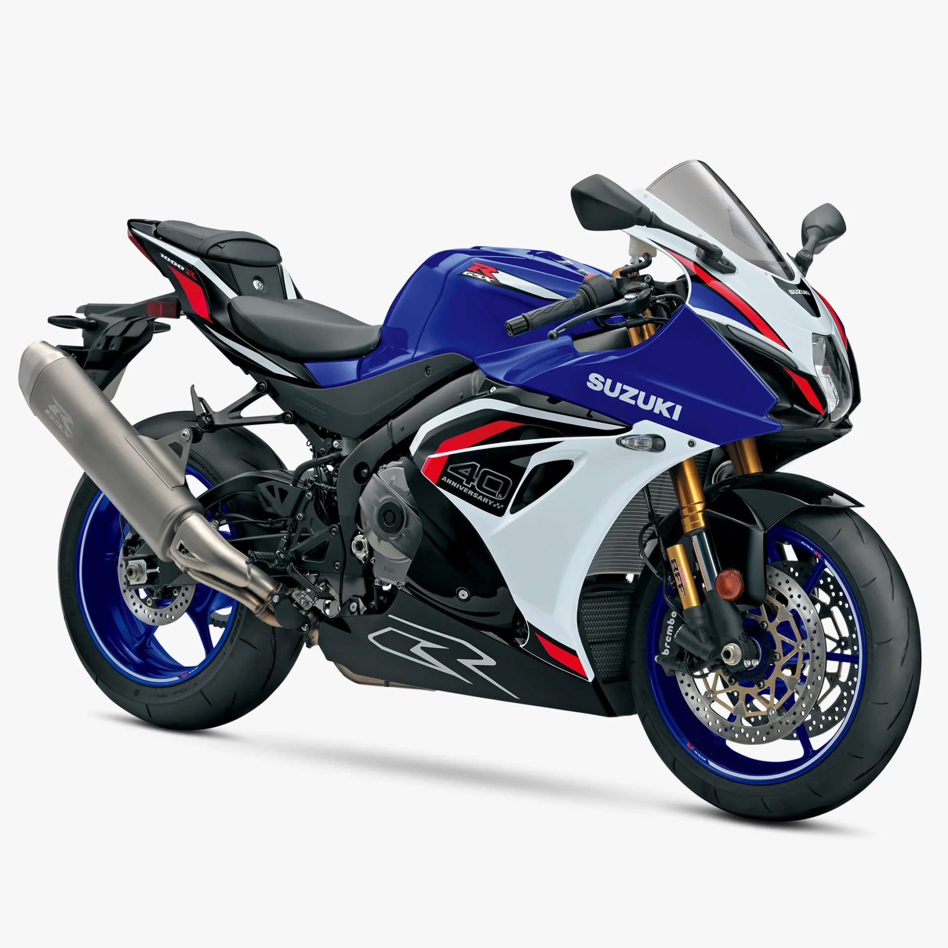 Blue, white, and red Suzuki GSX-R 1000R sport motorcycle with 40th anniversary decals and blue wheels.