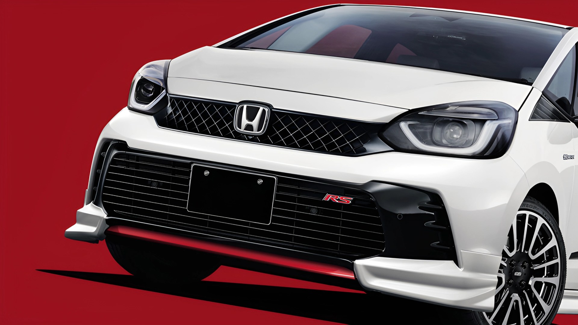 Front view of a white Honda car with RS badge and black grille on a red background.
