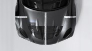 Glossy black car hood with white racing stripes and a "Development Prototype" label.