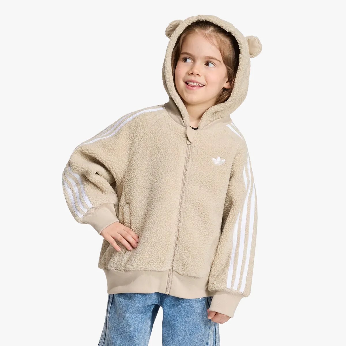 Child wearing beige fleece zip-up hoodie with bear ears on hood and white stripes on sleeves.