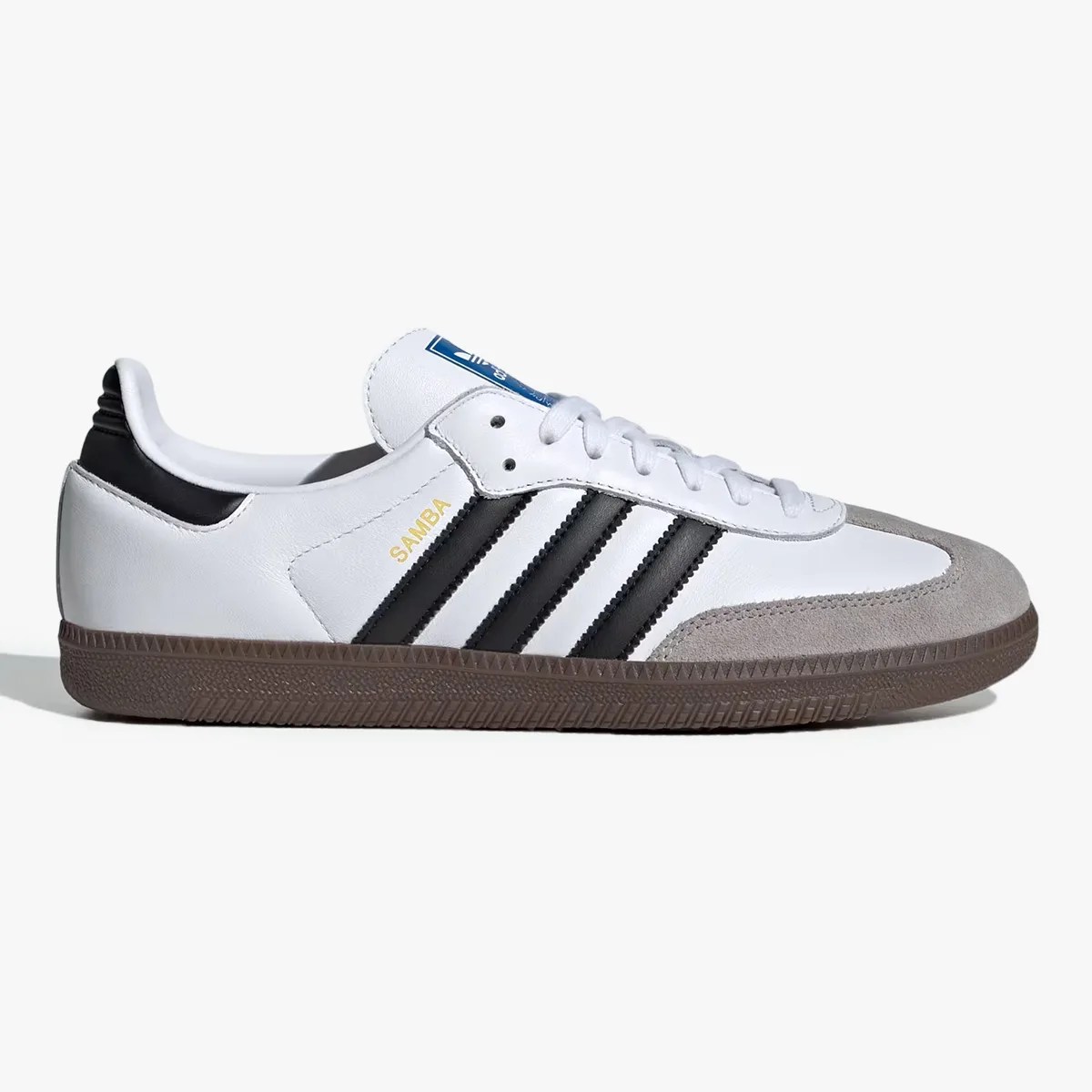 White Adidas Samba sneaker with black stripes, gray suede toe, and brown rubber sole.