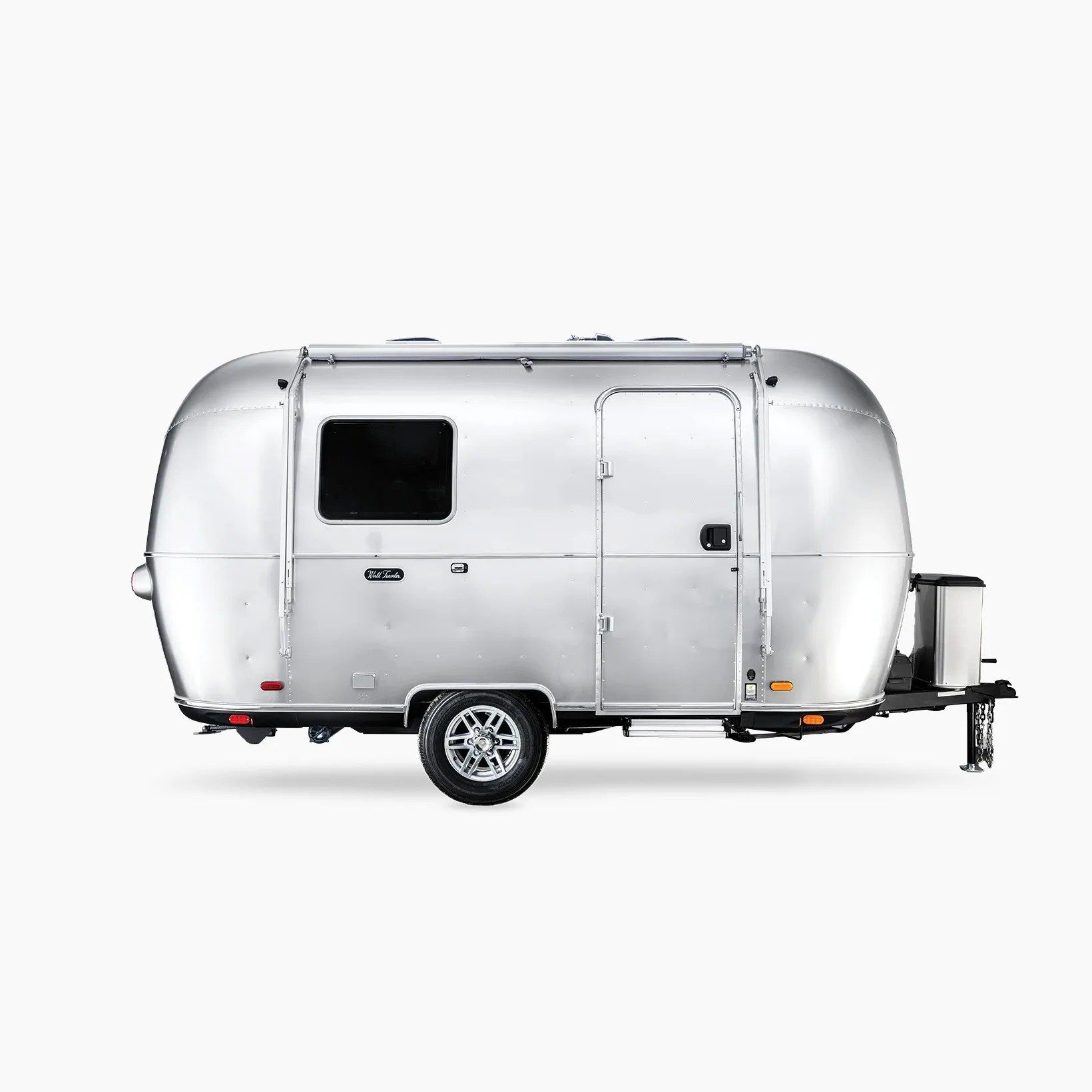Silver polished metal travel trailer with one window and a door on the side, single axle, and towing hitch.