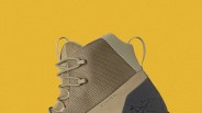 Close-up of a tan and olive green Konseal hiking shoe with textured fabric and laces against a yellow background.