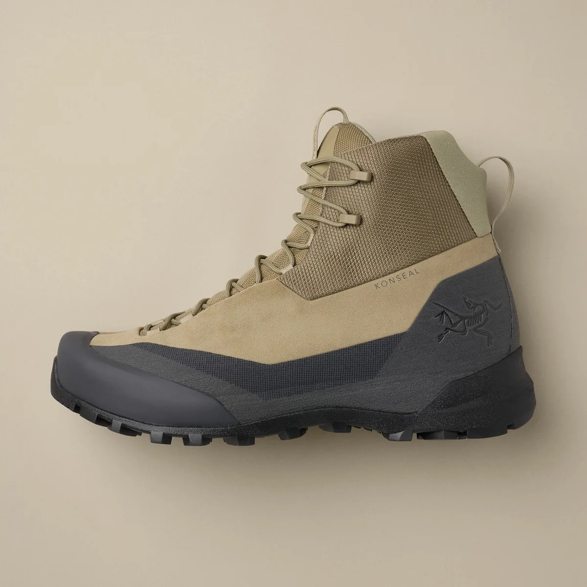 Tan and black high-top hiking boot with textured sole and "KONSEAL" branding on the side.