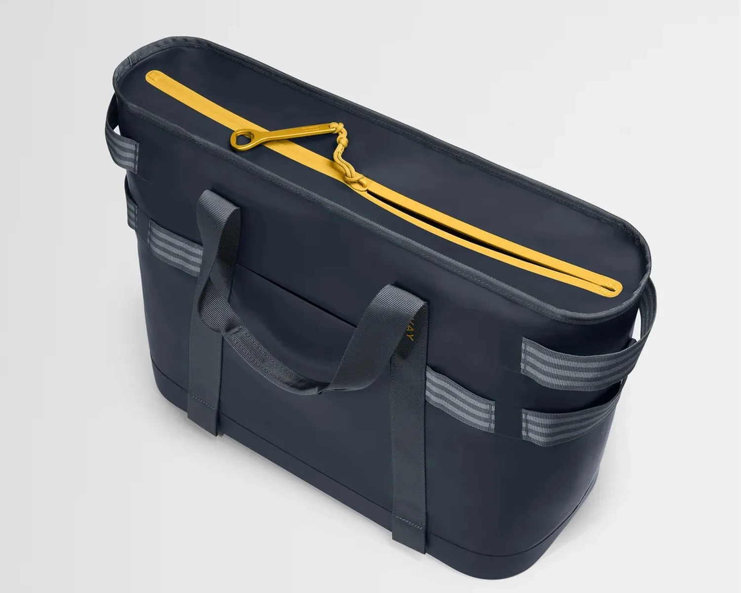 Navy blue rectangular tote bag with gray handles and a yellow zipper on top.
