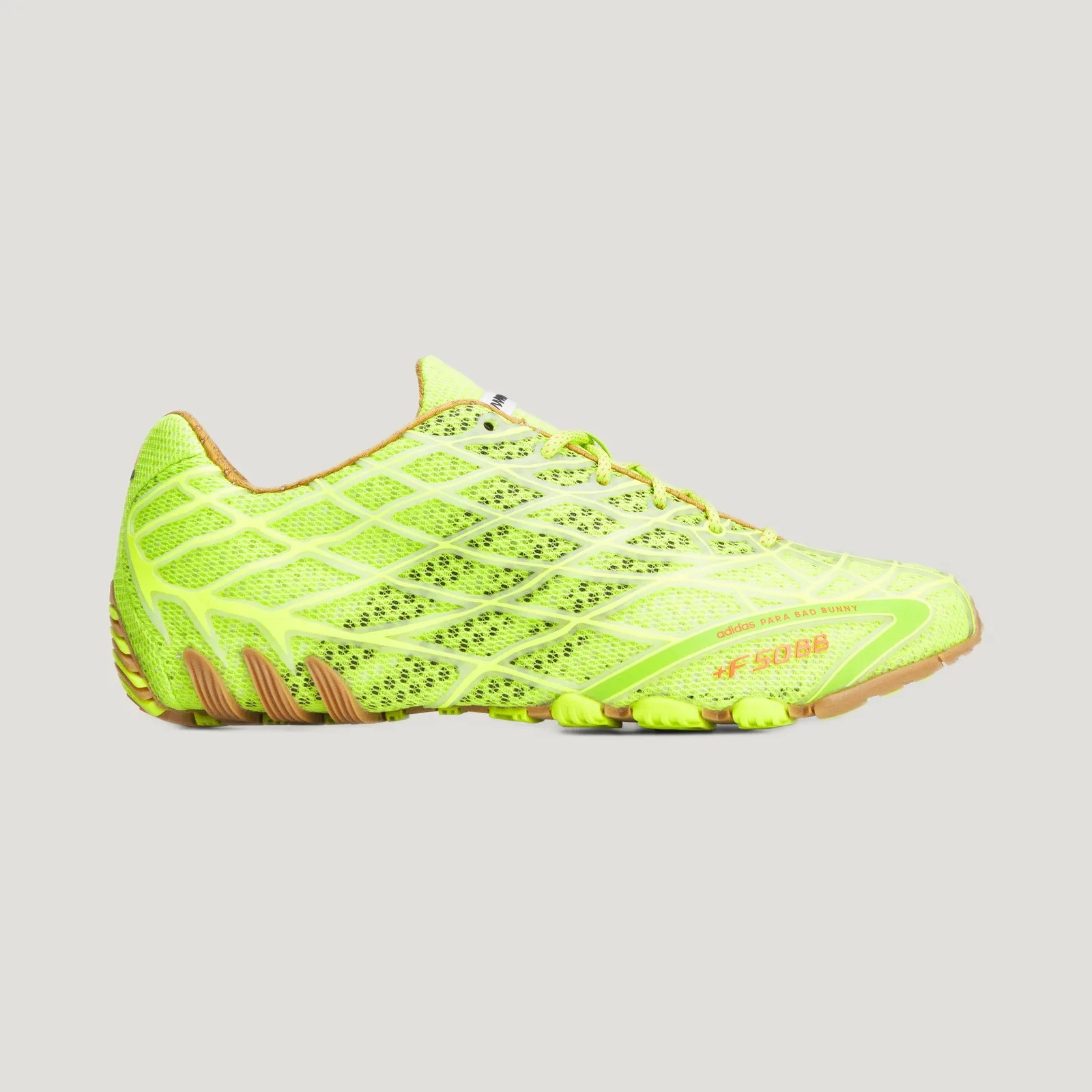 Neon yellow Adidas running shoe with mesh upper and gum sole, labeled "adidas PARA BAD BUNNY +F50BB.