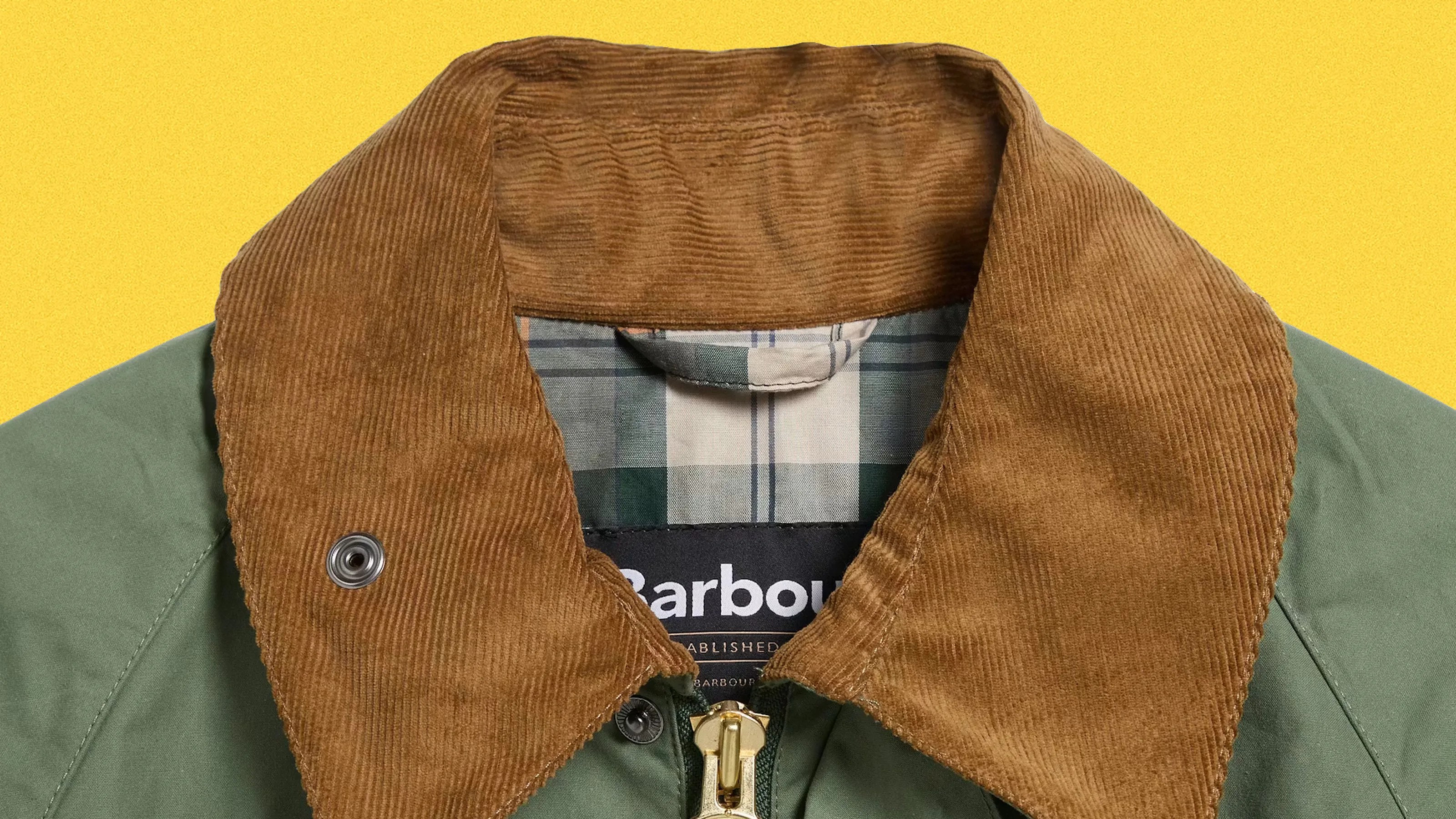 Green jacket with brown corduroy collar and plaid inner lining.