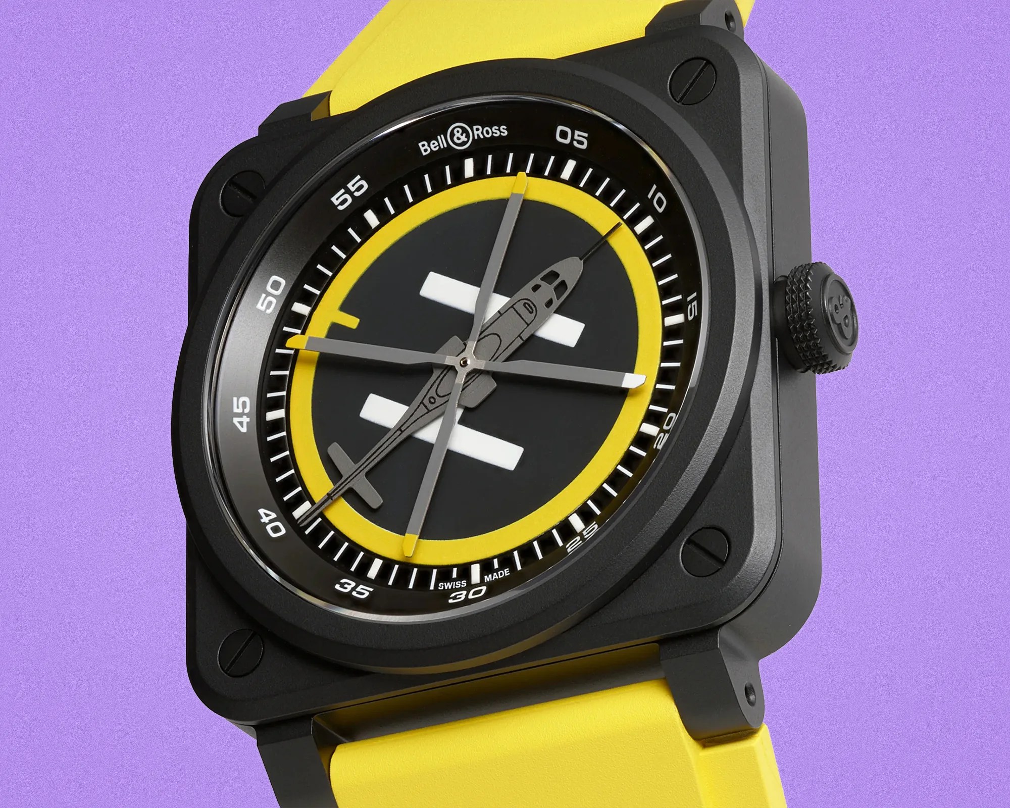 Black square Bell & Ross wristwatch with yellow ring and yellow strap on purple background.