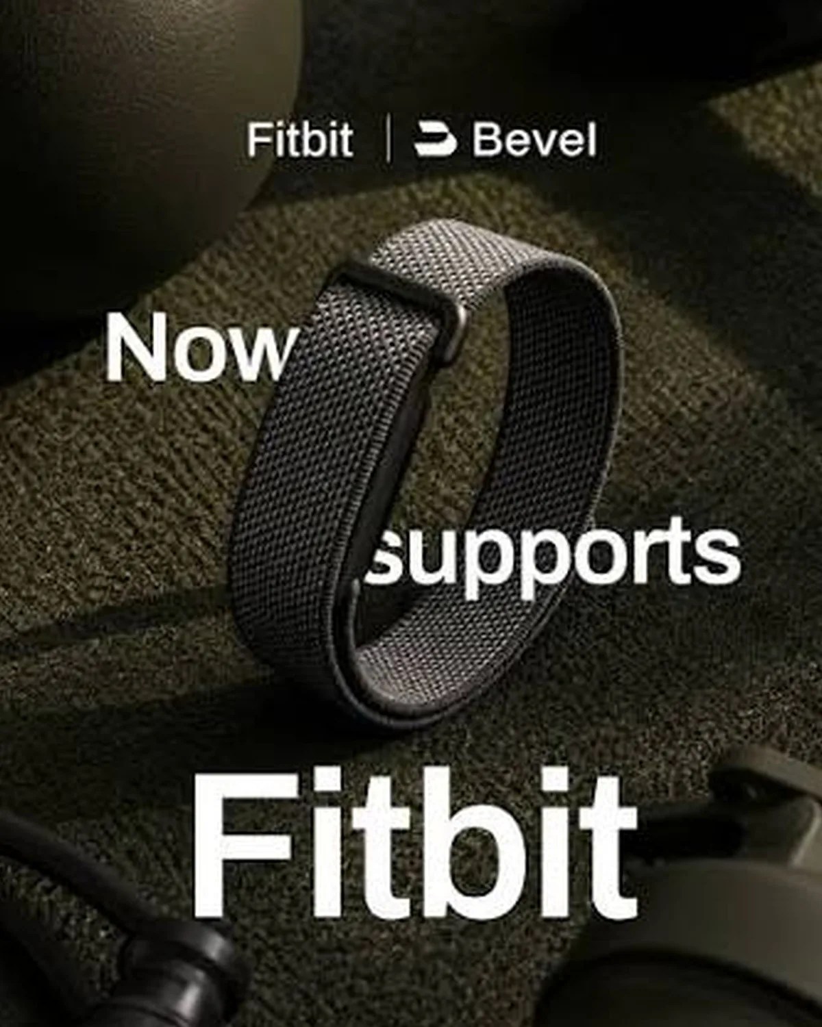 Black woven fabric Fitbit wristband on textured dark surface with partial text "Fitbit | Bevel" and "Now supports Fitbit.