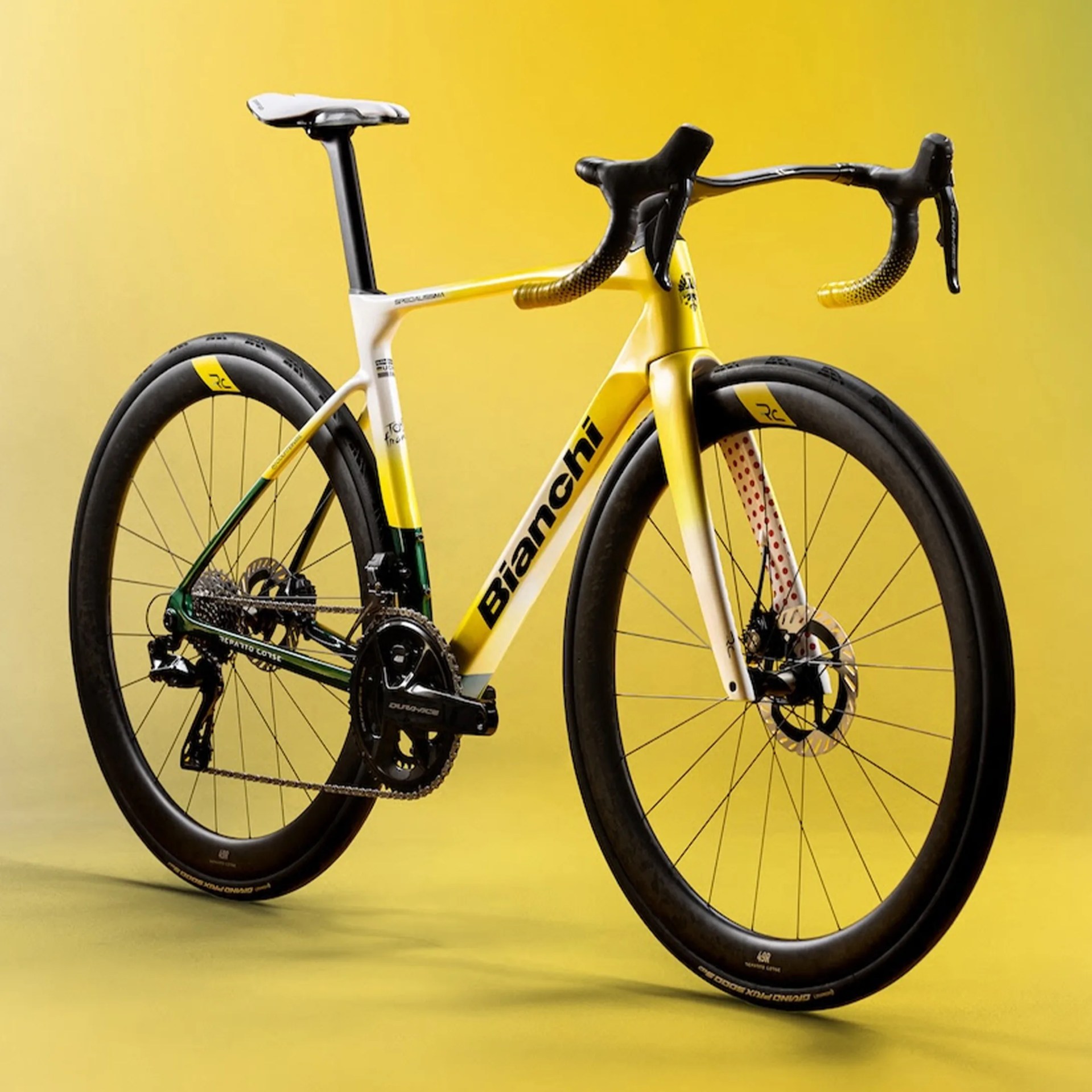 Yellow and white Bianchi road bike with black deep-section wheels and drop handlebars against a yellow background.
