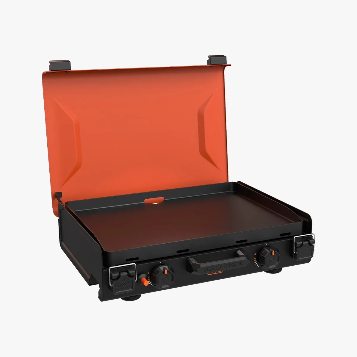 Black and orange portable flat-top griddle with two control knobs and a hinged lid open.