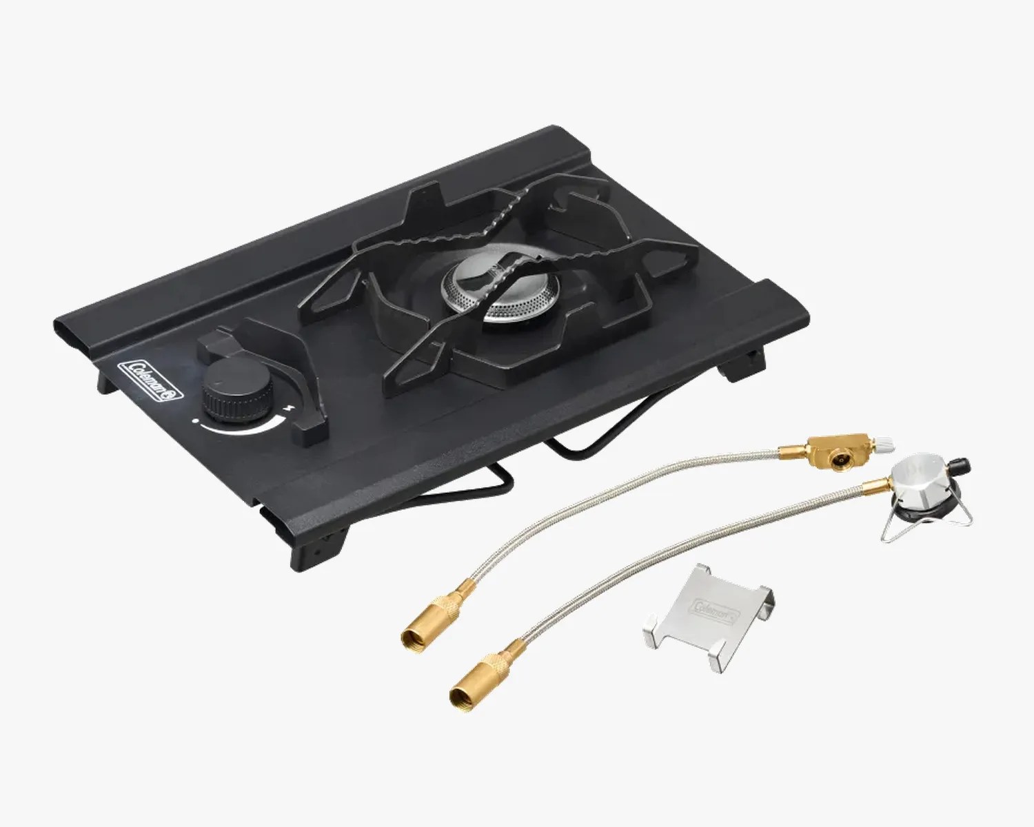Black Coleman single-burner camping stove with control knob and two brass hose connectors.