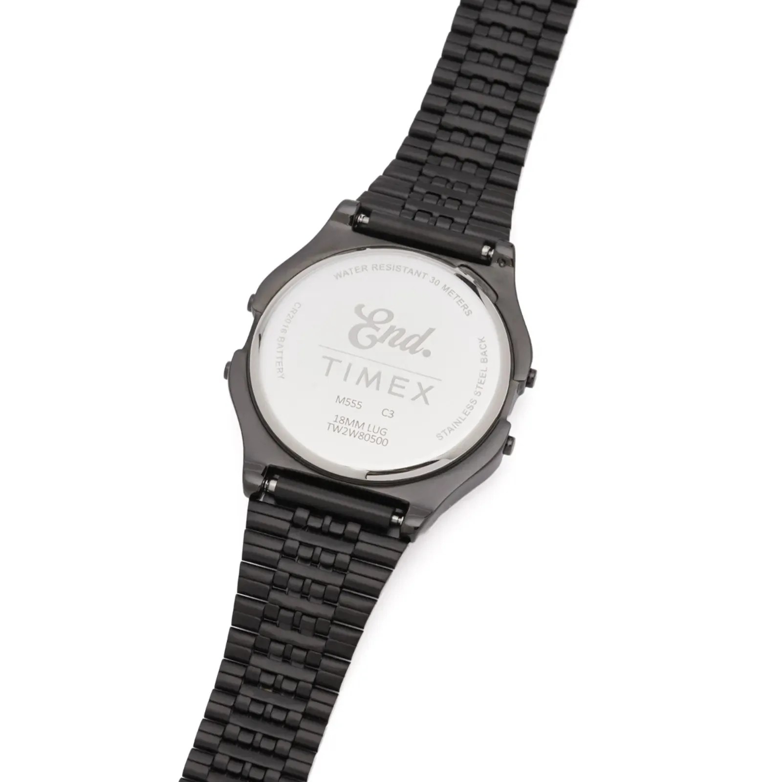 Back of a black metal-link Timex watch with "End." branding and water resistance details.