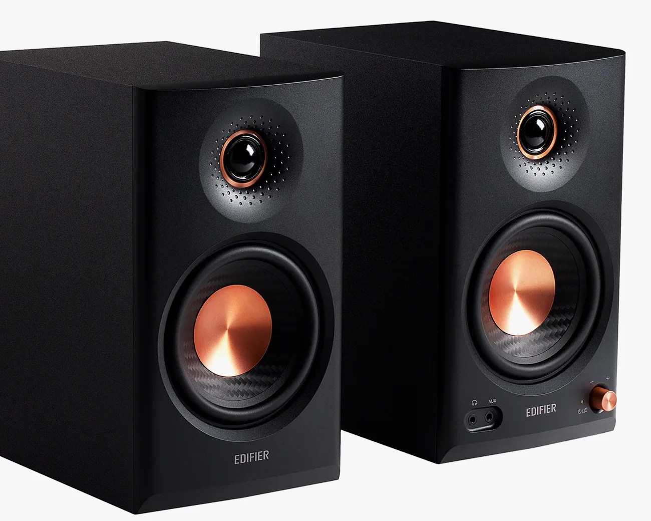 Pair of black Edifier speakers with copper-colored speaker cones and control knob.