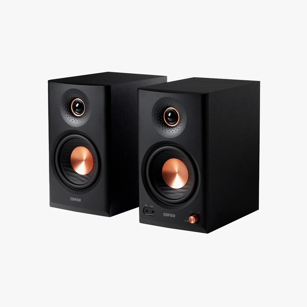 Pair of black Edifier speakers with copper-colored speaker cones and control knob on one speaker.