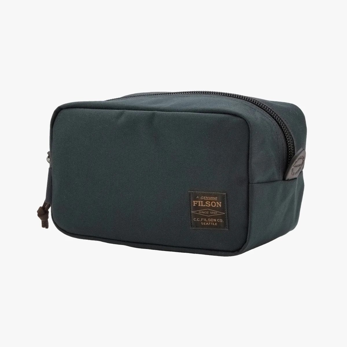 Dark green rectangular Filson toiletry bag with a front label and black zipper.