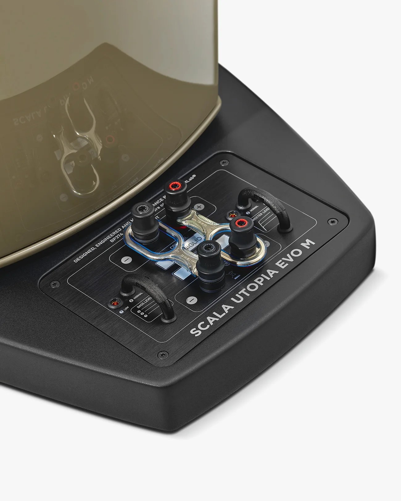 Close-up of black Scala Utopia EVO M speaker base with metal speaker wire connectors and adjustment knobs.