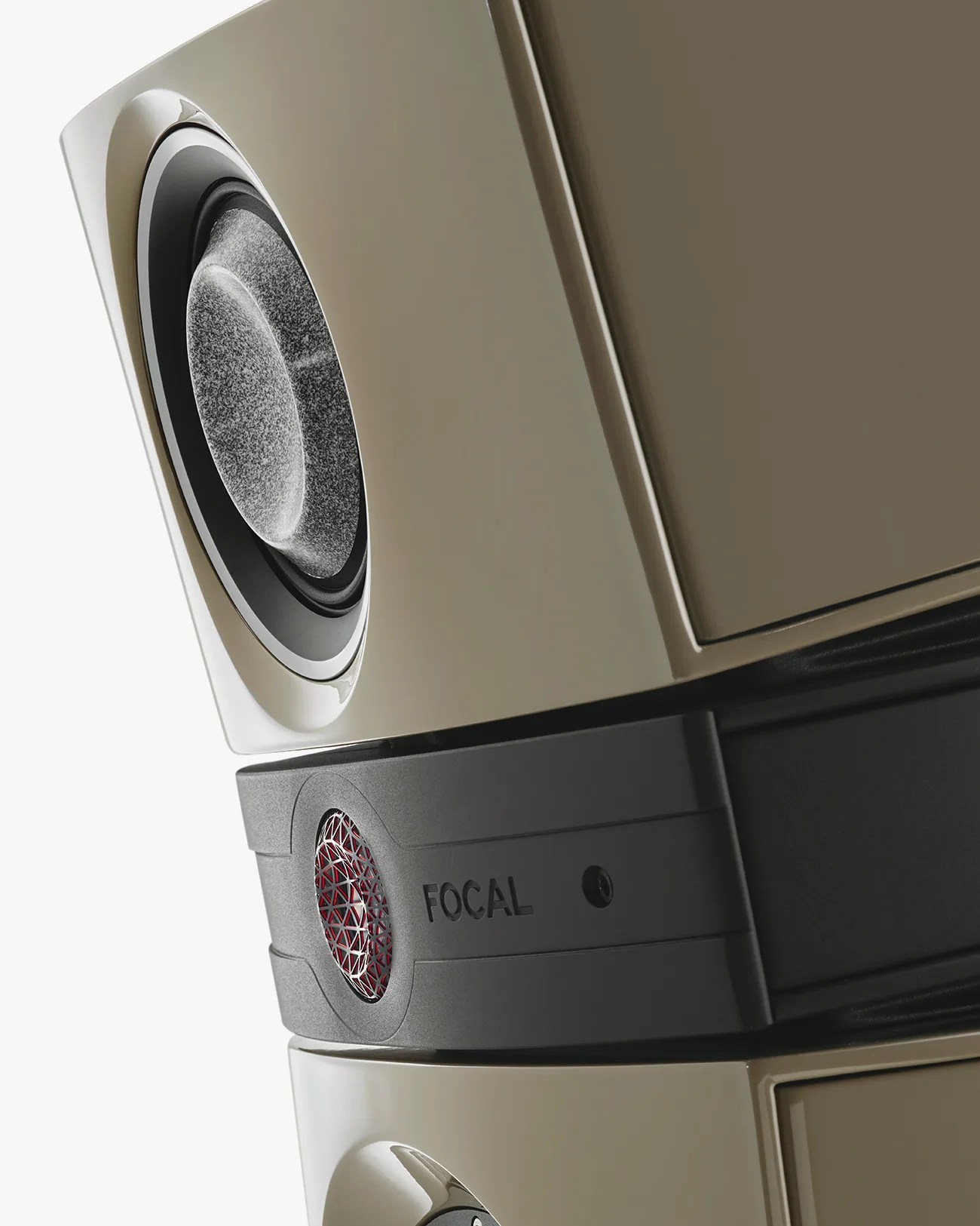Close-up of a beige Focal speaker with a textured driver and a red mesh-covered tweeter.