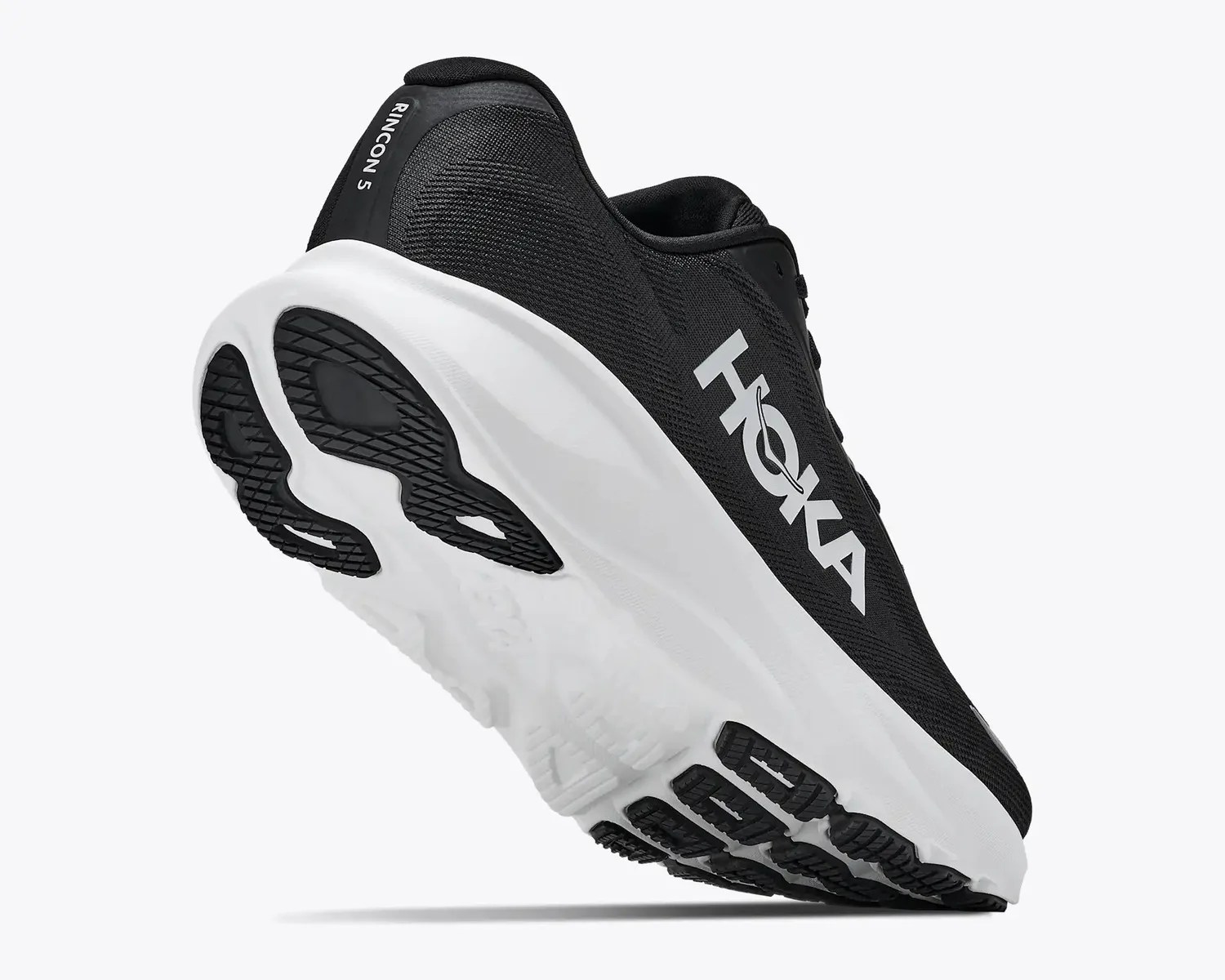 Black and white Hoka Rincon 5 running shoe with thick white sole and black outsole tread.