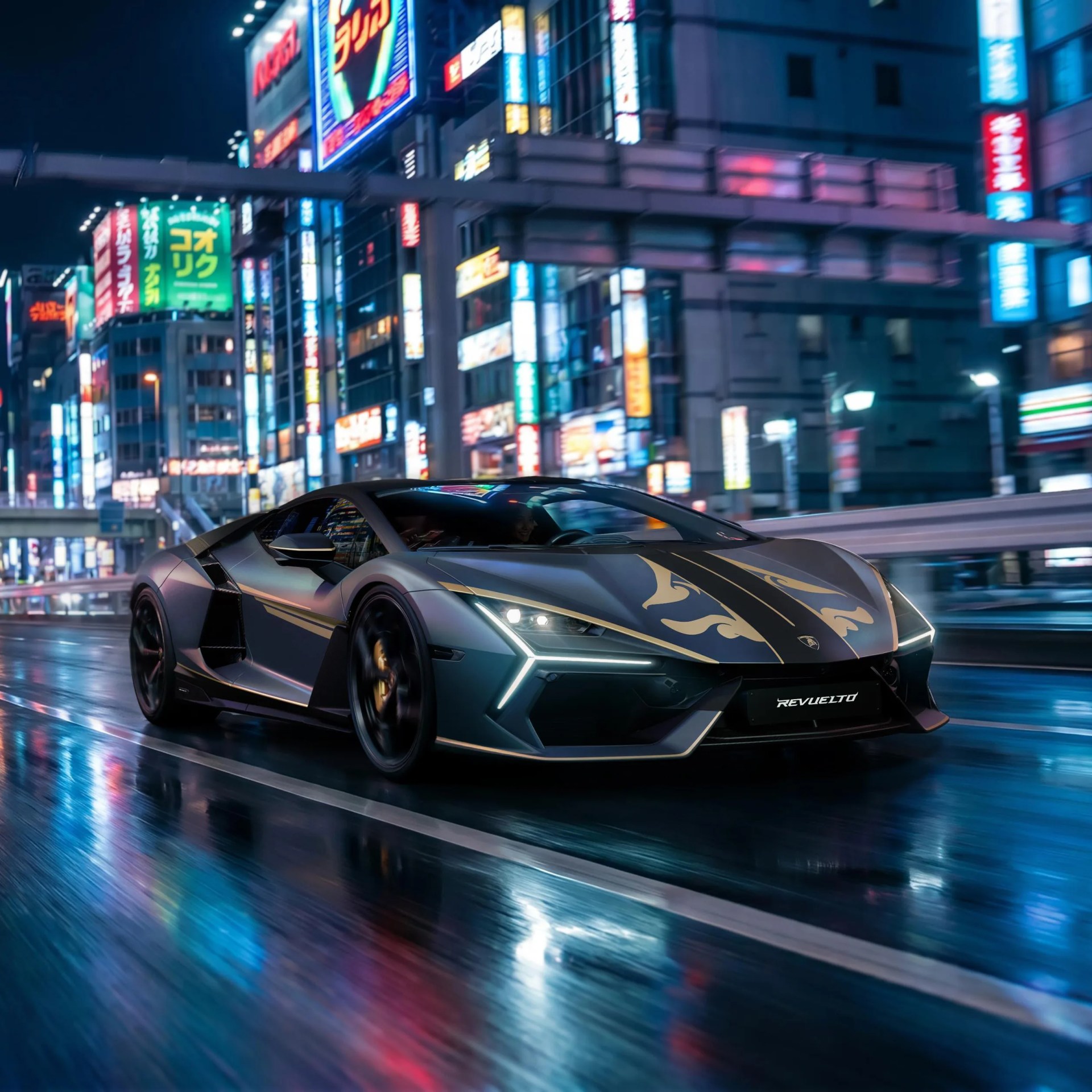 Matte gray Lamborghini with gold flame decals driving on a wet city street at night with neon signs.