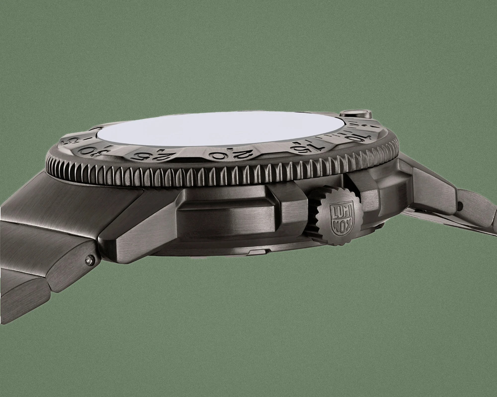 Brushed metal watch case with a rotating bezel marked with numbers and a crown engraved with the Luminox logo.