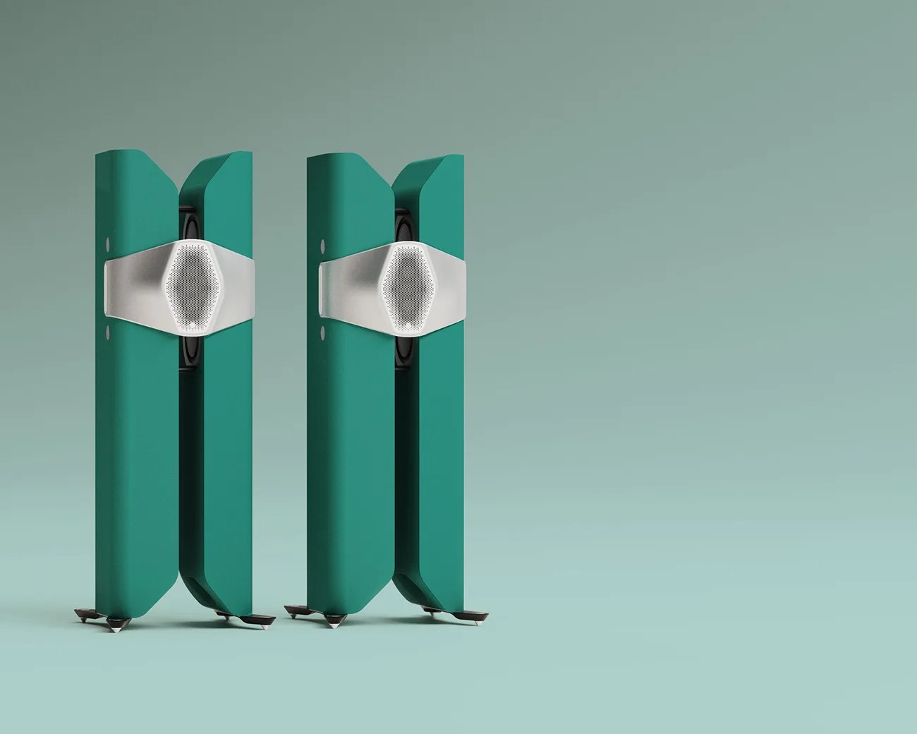 Pair of tall, teal, modern speakers with silver hexagonal grills on a teal surface and background.