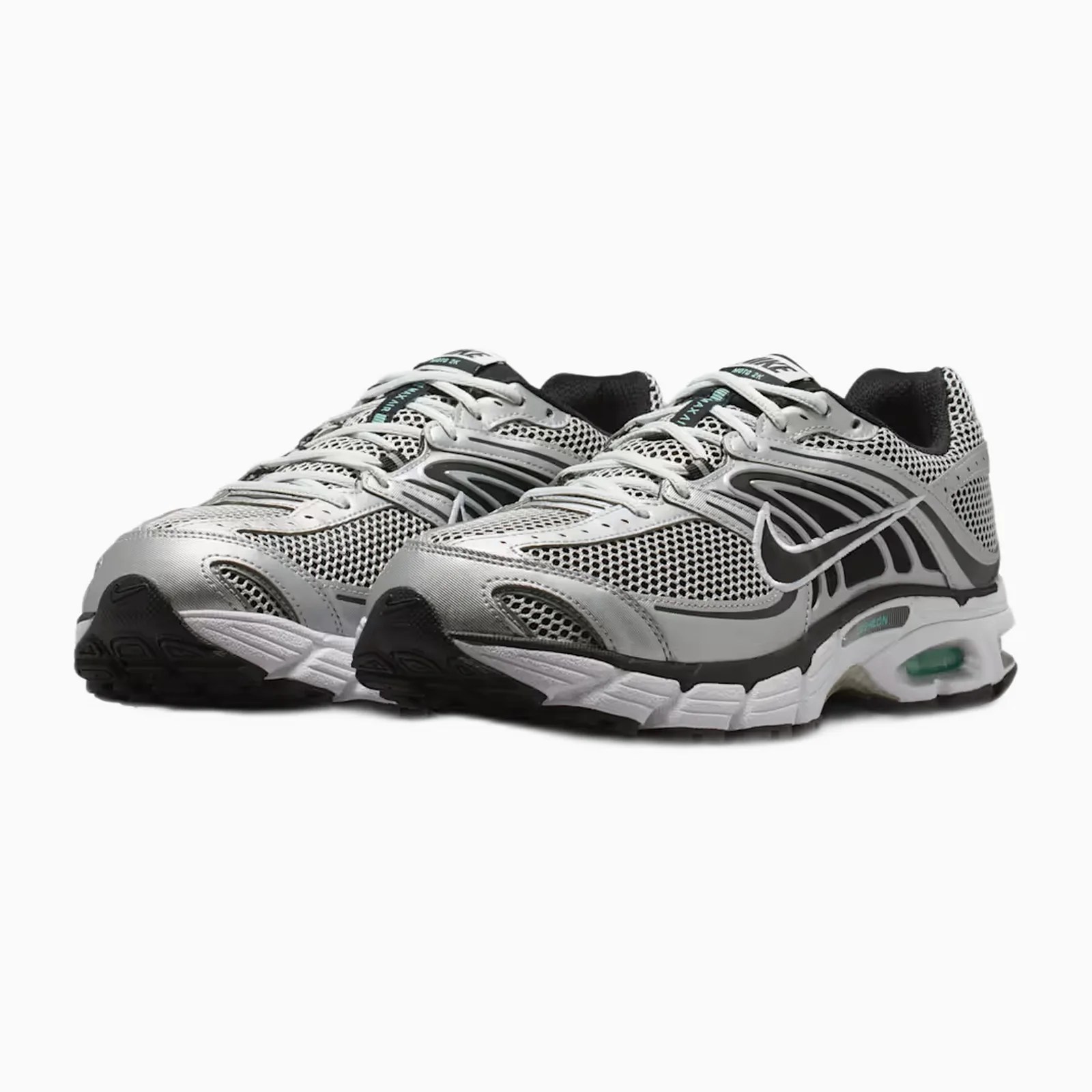 Pair of silver and black Nike running shoes with mesh upper and visible air cushioning in the sole.