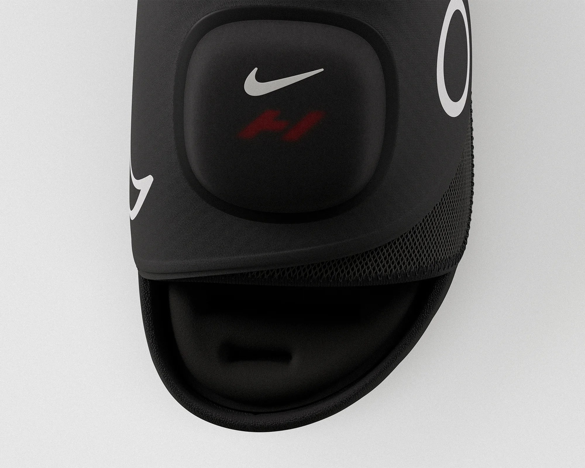 Black Nike sports glove with white swoosh logo and red "H1" marking on padded knuckle area.