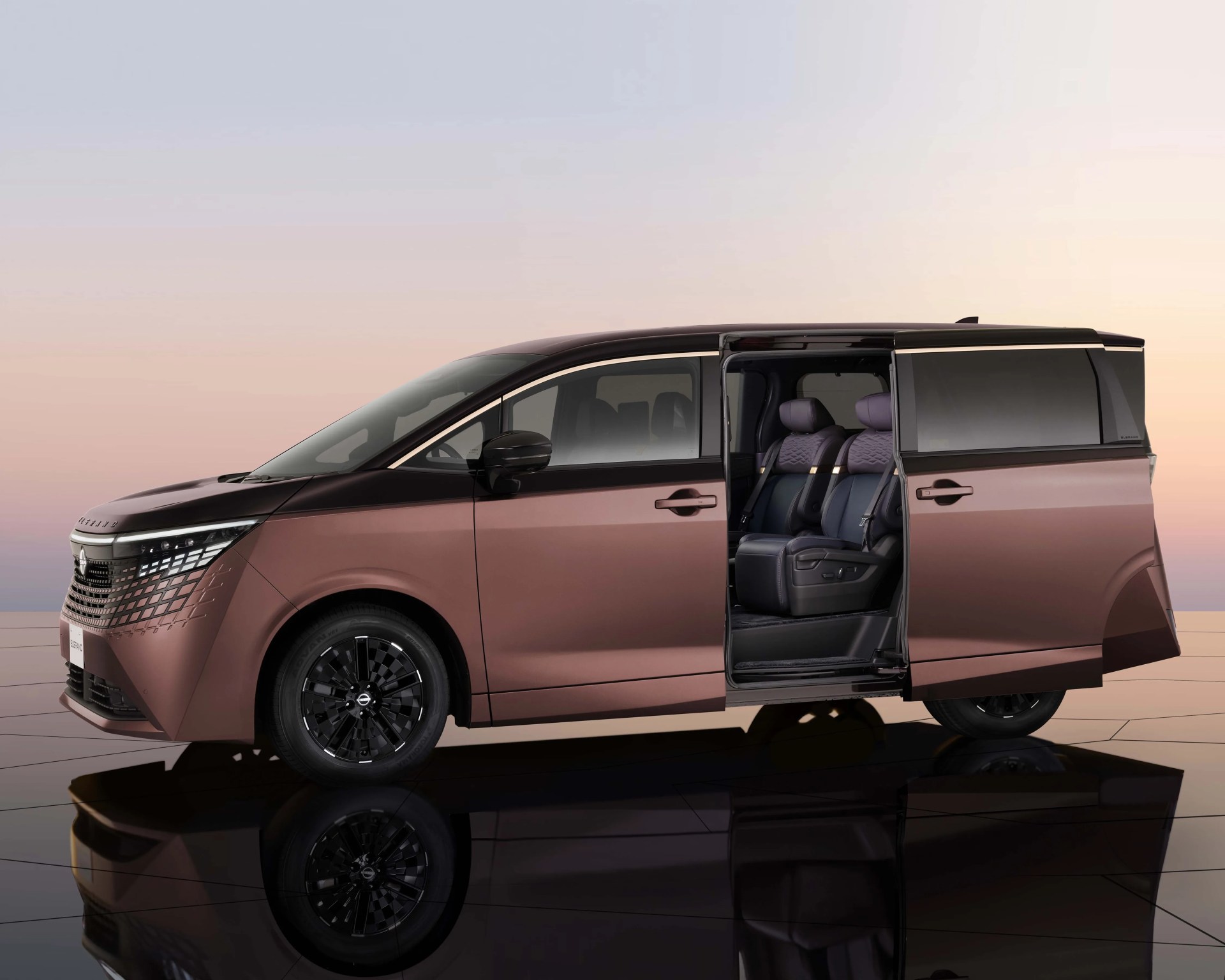 Metallic brown minivan with black roof and sliding door open showing two black leather seats inside.