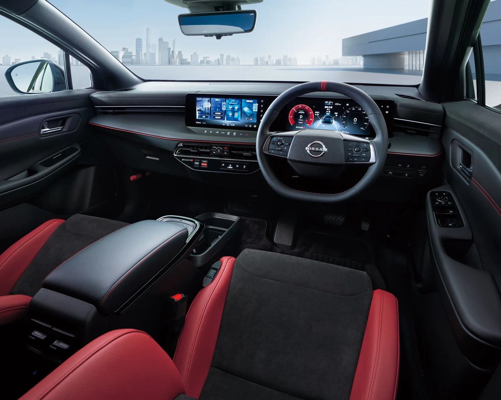 Interior of a Nissan car featuring a black and red leather seat, digital dashboard, and touchscreen display.