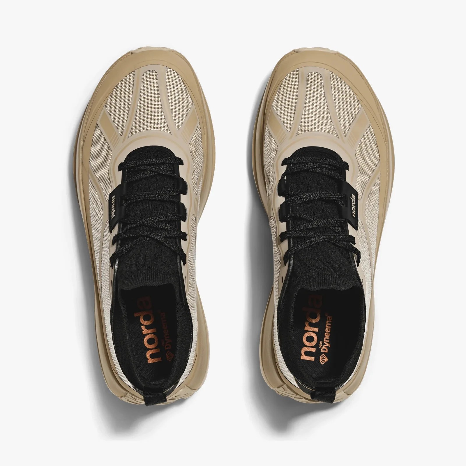 Pair of beige and black sneakers with mesh uppers and black laces viewed from above.