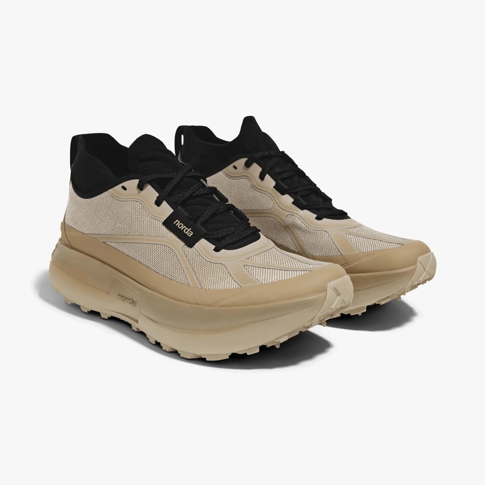 Beige and black Norda running shoes with thick soles and mesh fabric uppers.