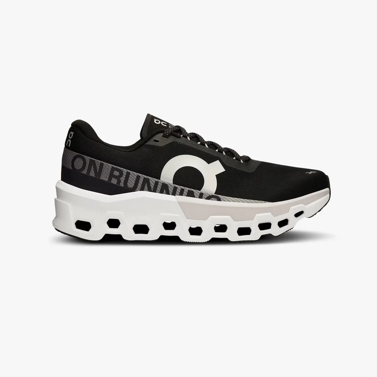 Black and white running shoe with hexagonal cutouts in the thick white sole and "ON RUNNING" text on the side.