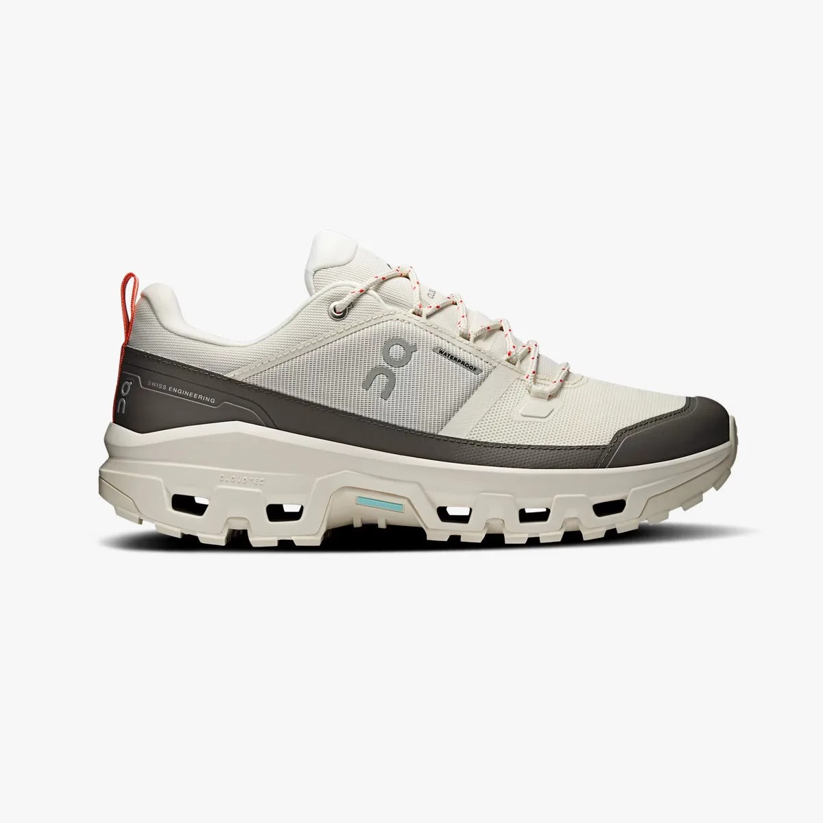 Beige and dark gray waterproof trail running shoe with rugged sole and red pull tab.