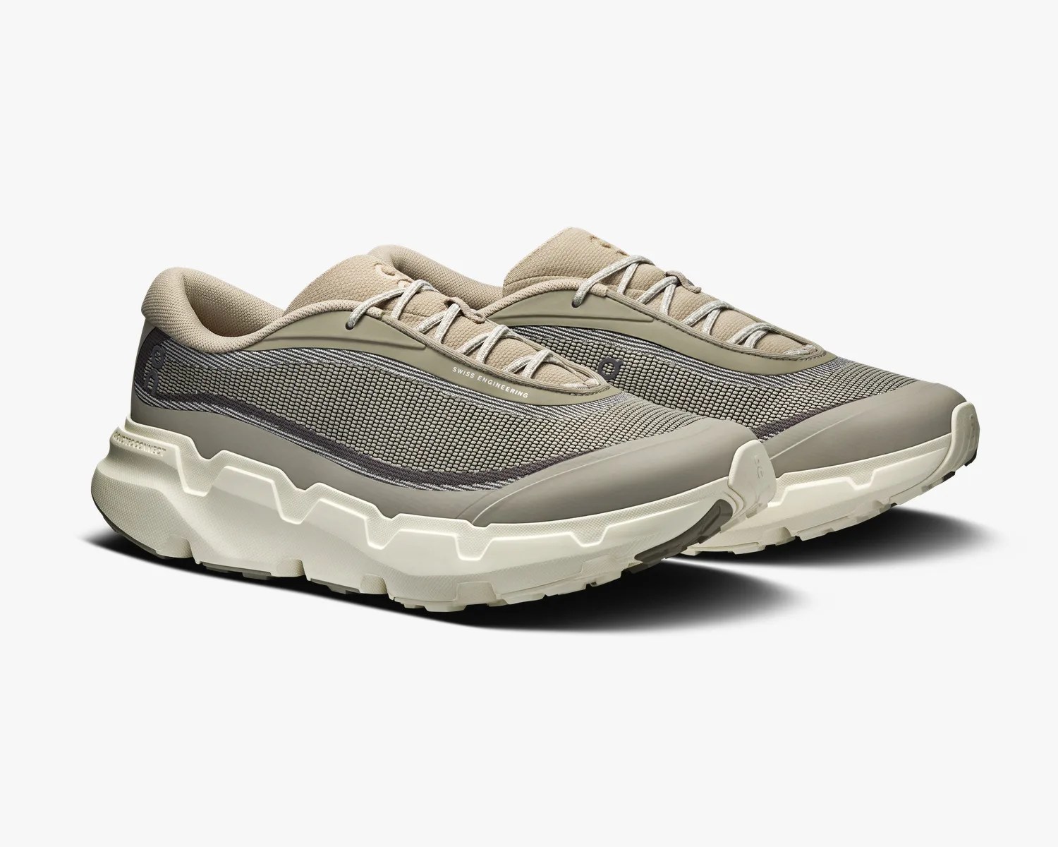 Pair of beige and gray mesh sneakers with thick white soles and "Swiss Engineering" text on the side.