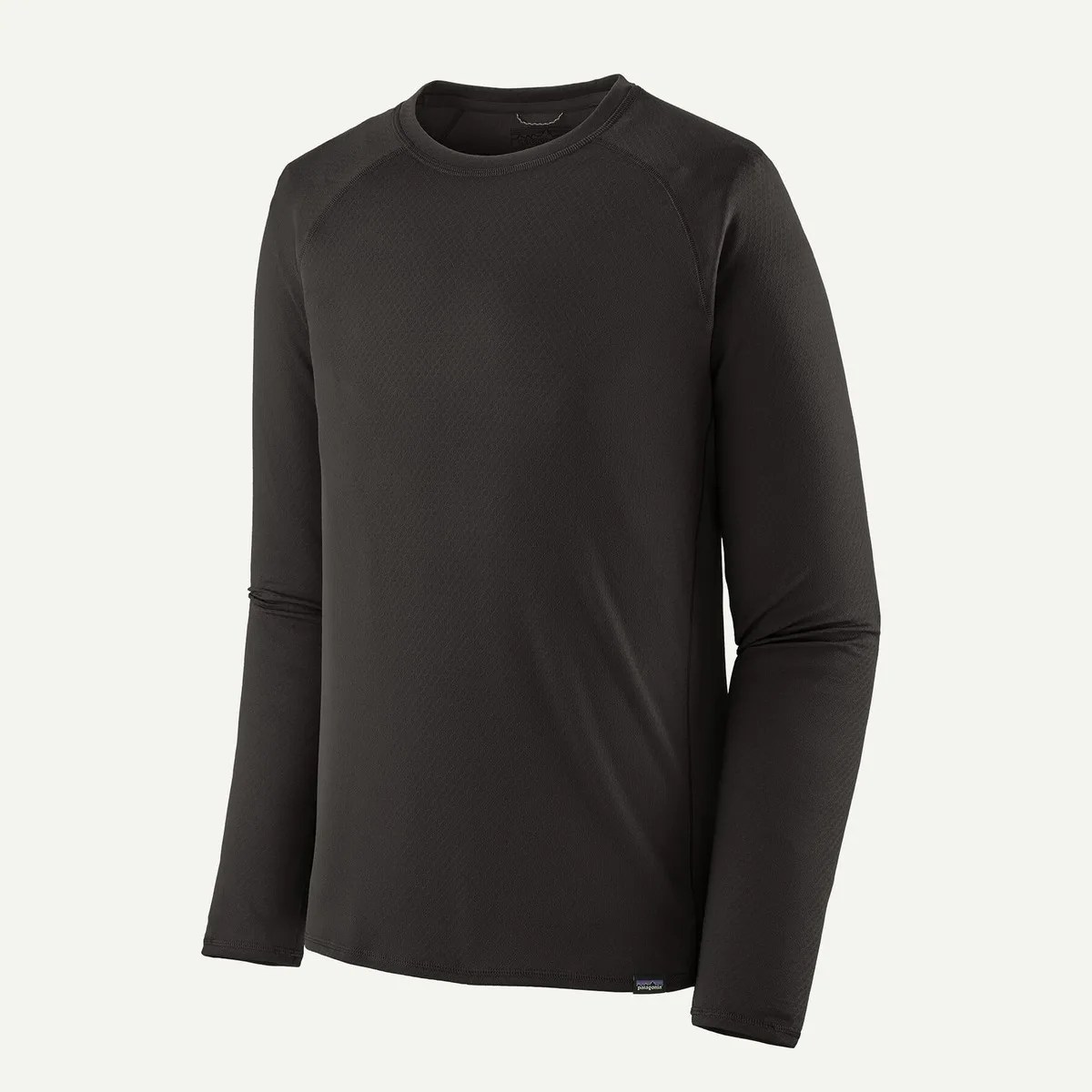 Black long-sleeve crew neck shirt with a small Patagonia logo tag at the hem.