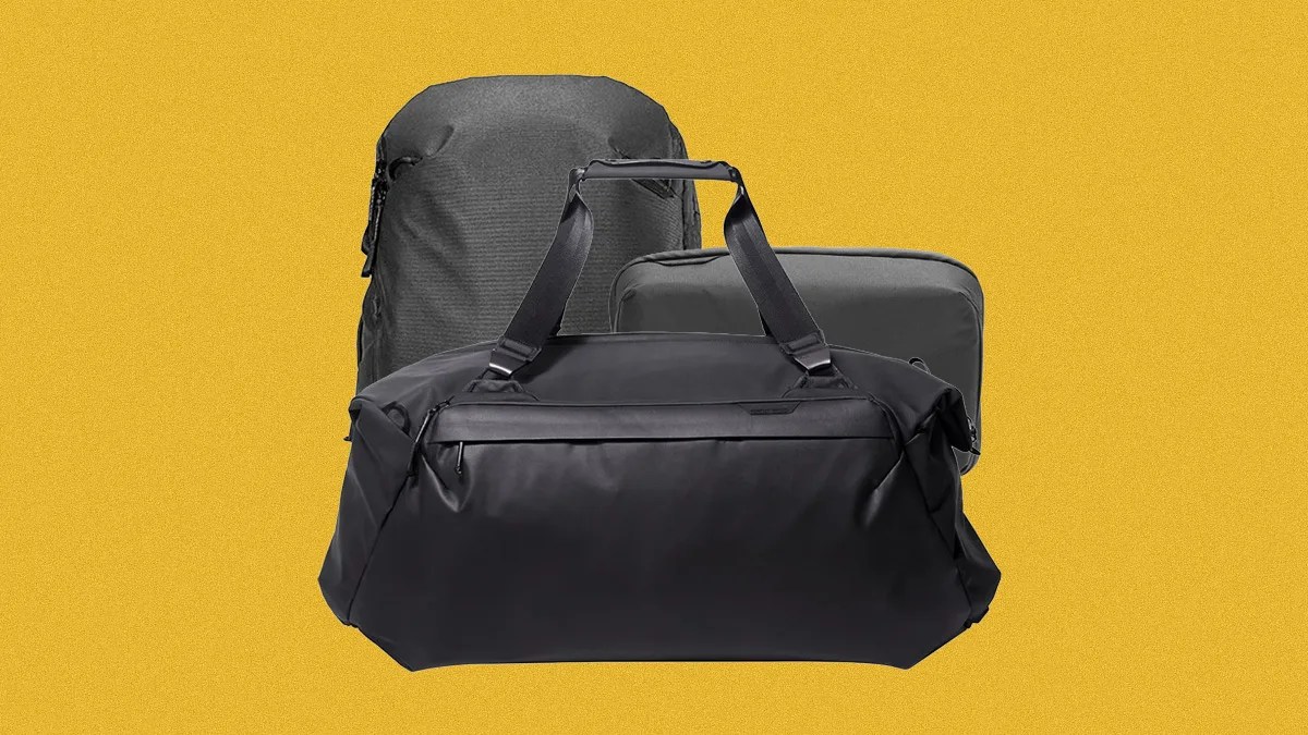Three black travel bags including a duffel bag, a backpack, and a rectangular pouch against a yellow background.