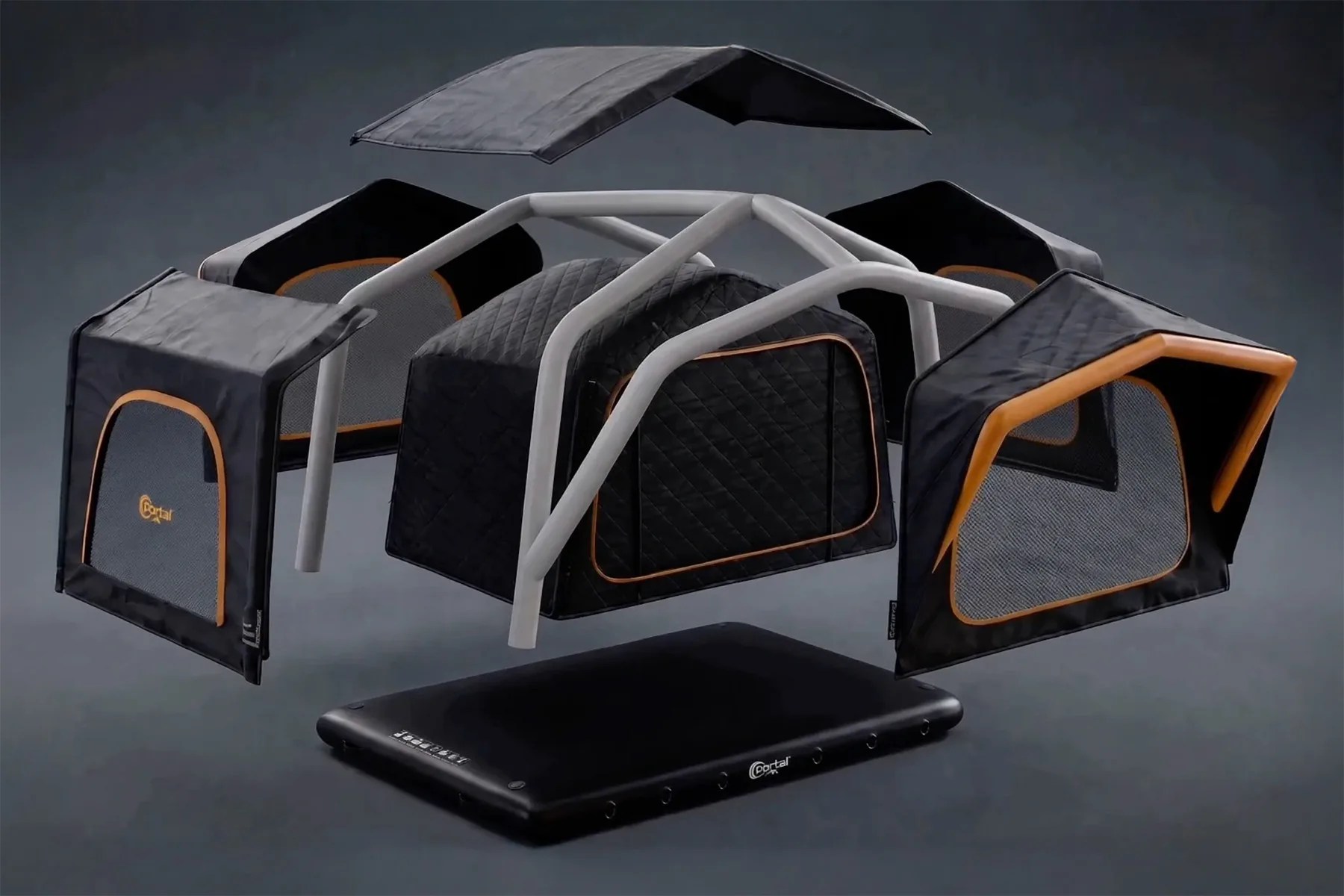 Black and orange modular pet carrier with mesh windows and a gray frame on a black base.