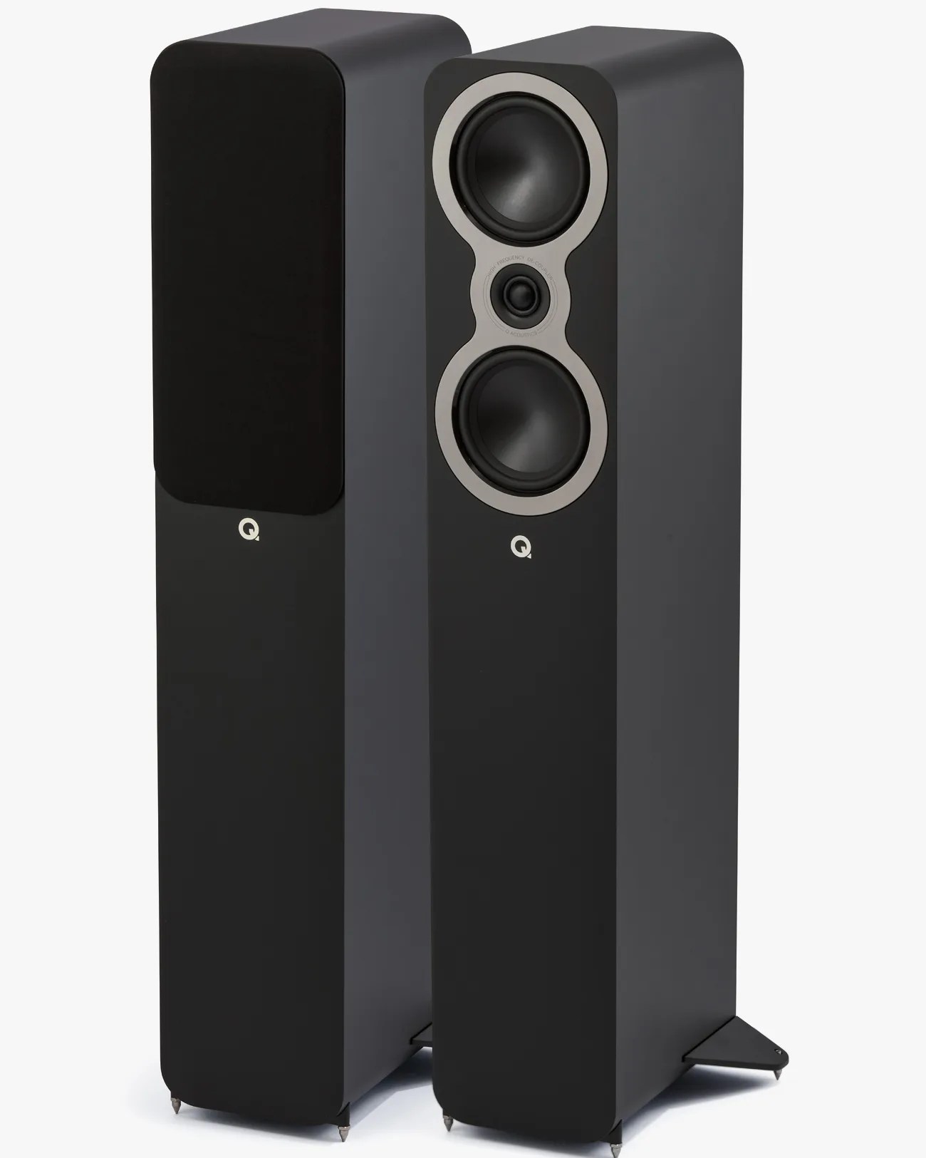 Pair of tall black floor-standing speakers, one with grille cover and one showing dual woofers and a tweeter.