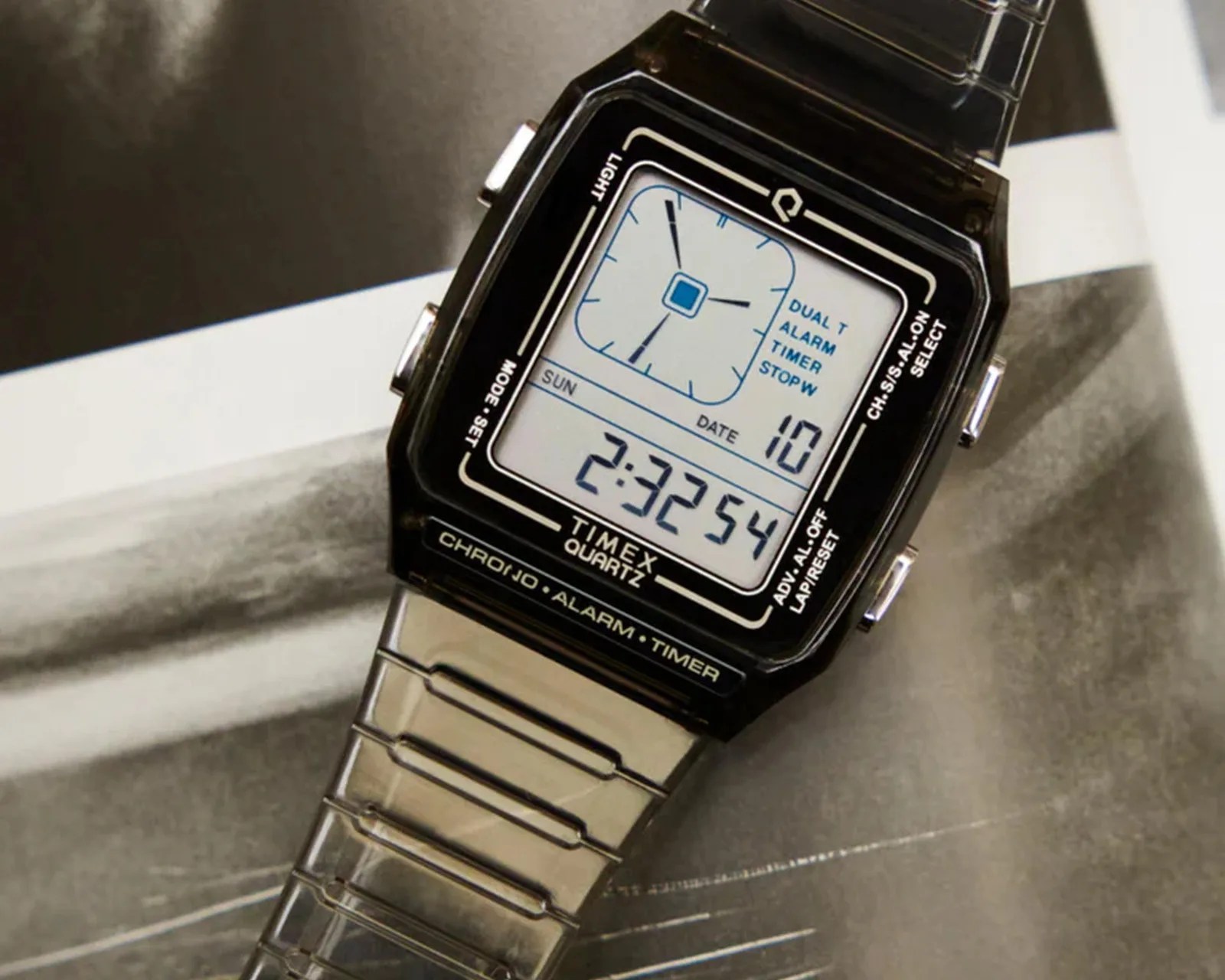 Digital Timex Quartz watch with a black rectangular face and silver metal band.