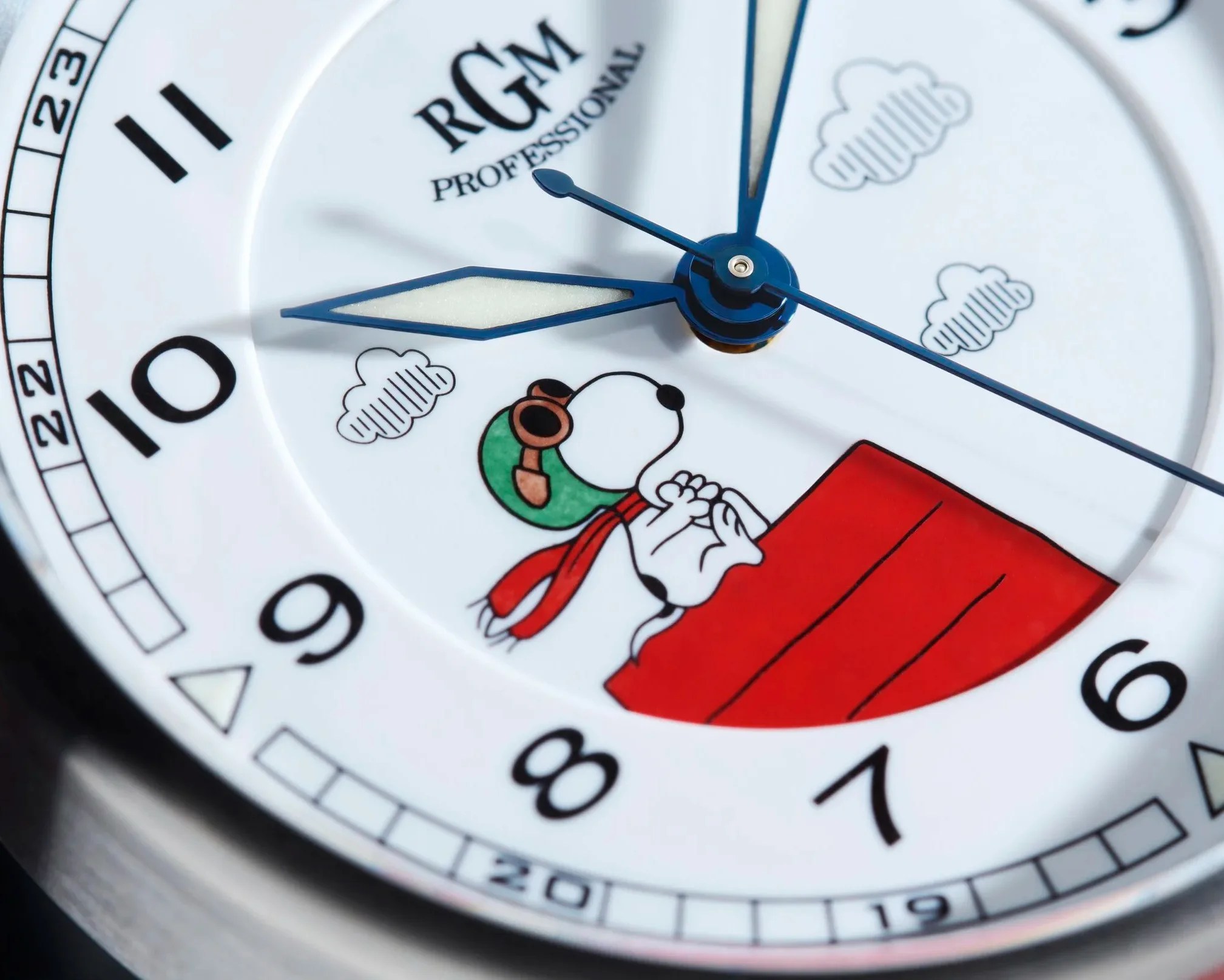 Close-up of a white watch face with blue hands, black numerals, and a Snoopy illustration wearing aviator goggles and a red scarf.