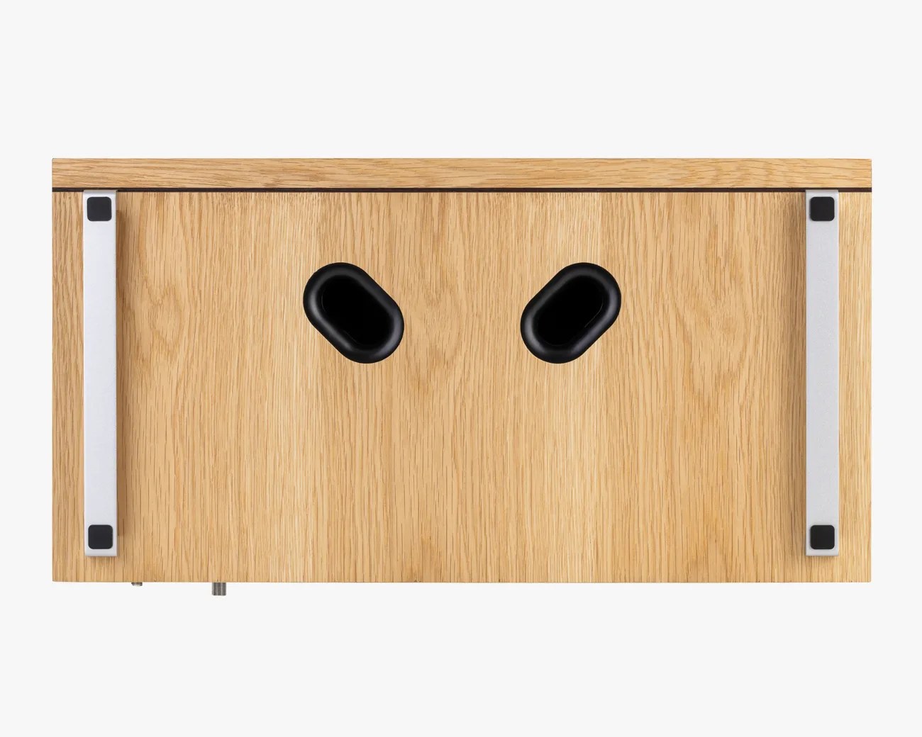 Rectangular wooden box with two black oval holes and two silver metal handles on the sides.