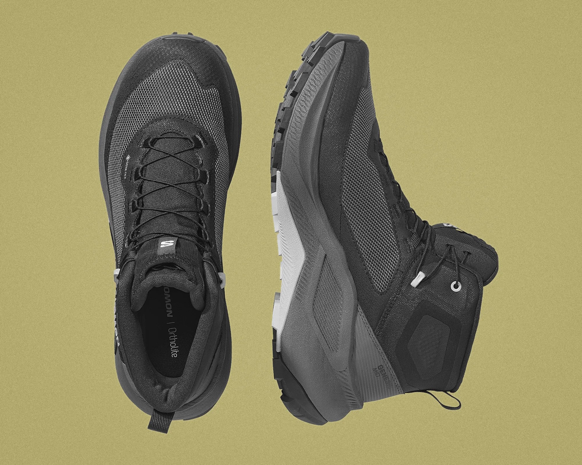 Pair of black and gray trail running shoes with textured mesh uppers and rugged soles on a beige background.