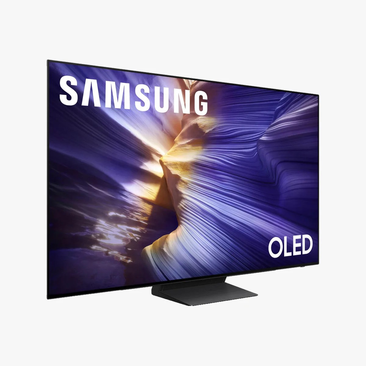 Samsung OLED flat-screen TV with a black stand displaying a vibrant abstract image.