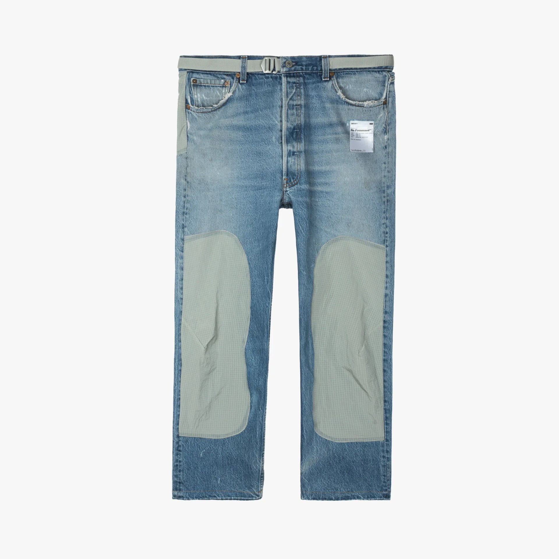 Light blue denim jeans with gray fabric patches on knees and a gray belt threaded through belt loops.