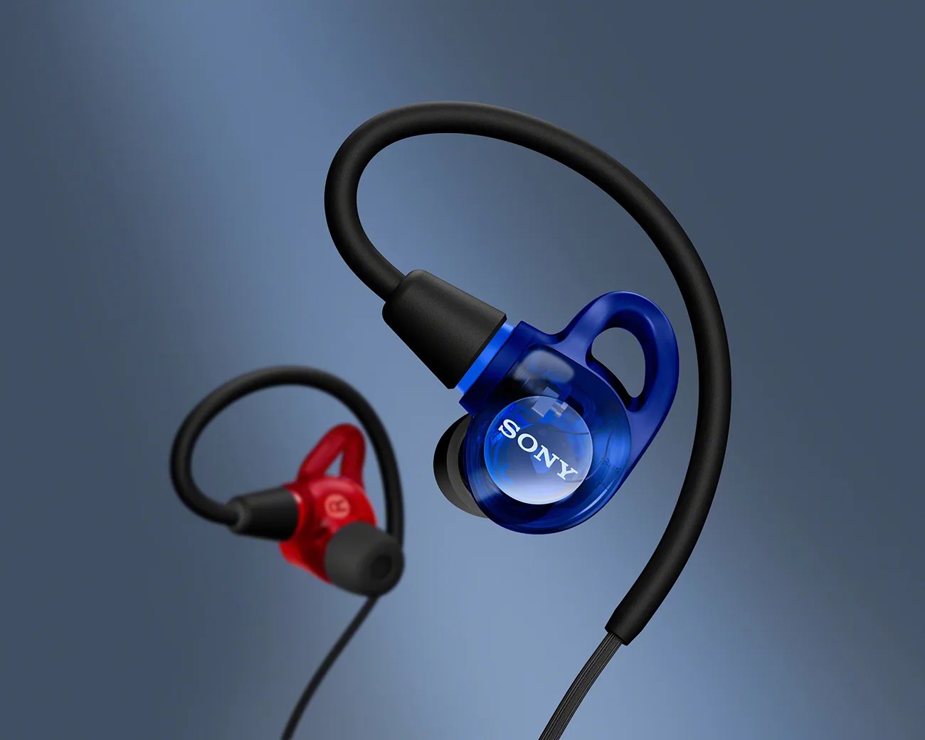 Pair of Sony in-ear headphones with blue and red translucent housings and black ear hooks.