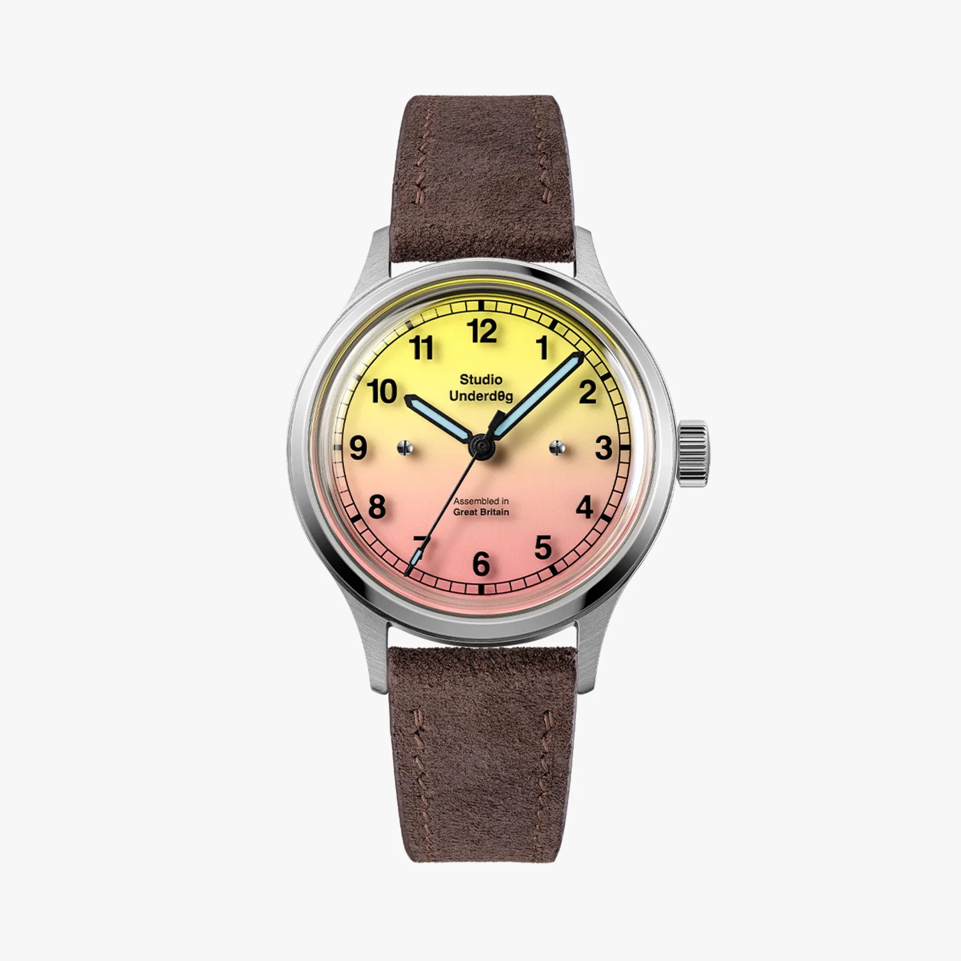 Round stainless steel watch with gradient yellow to pink dial, black numerals, blue hands, and brown suede strap.
