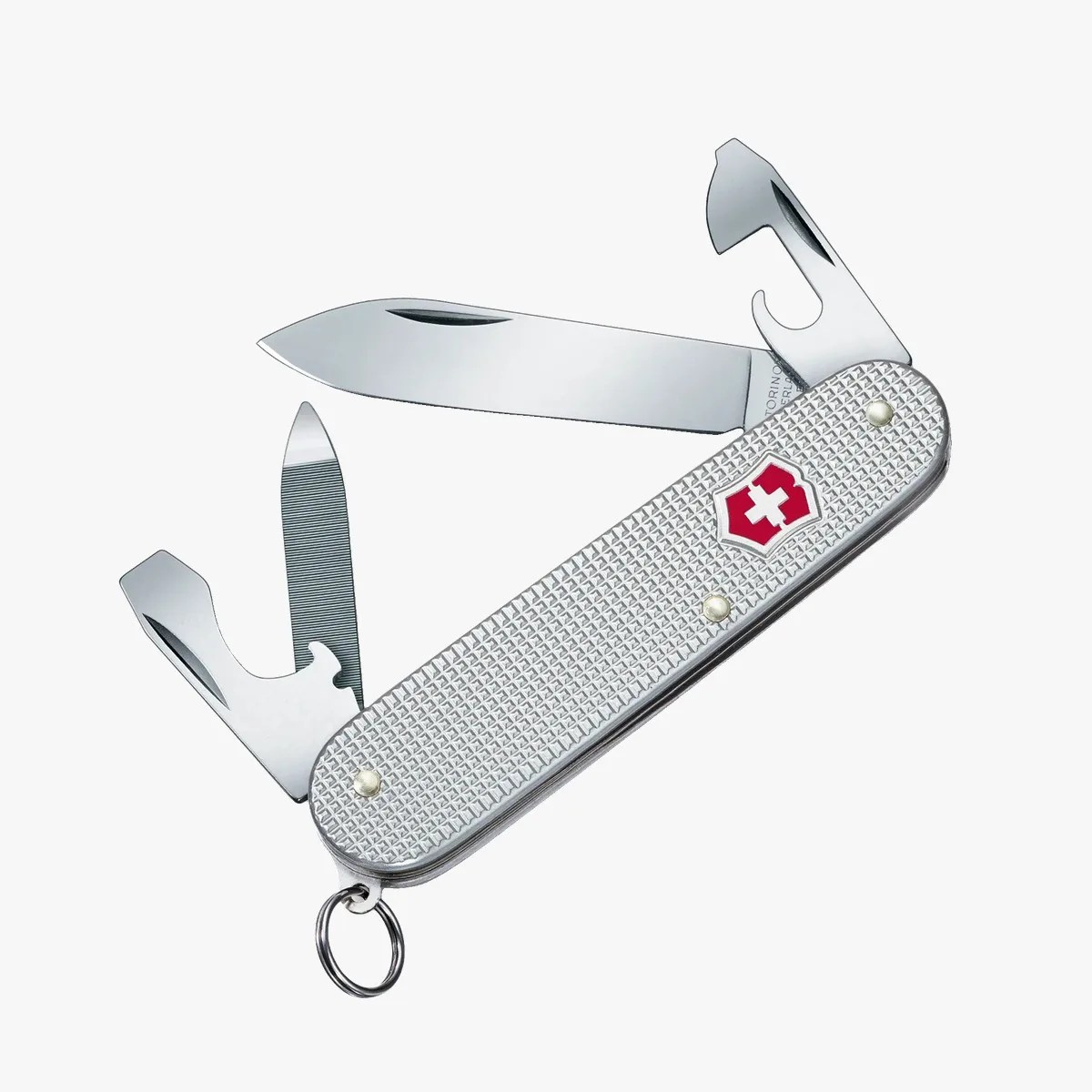 Silver Swiss Army knife with textured handle, red and white cross logo, and multiple open tools including blade and bottle opener.