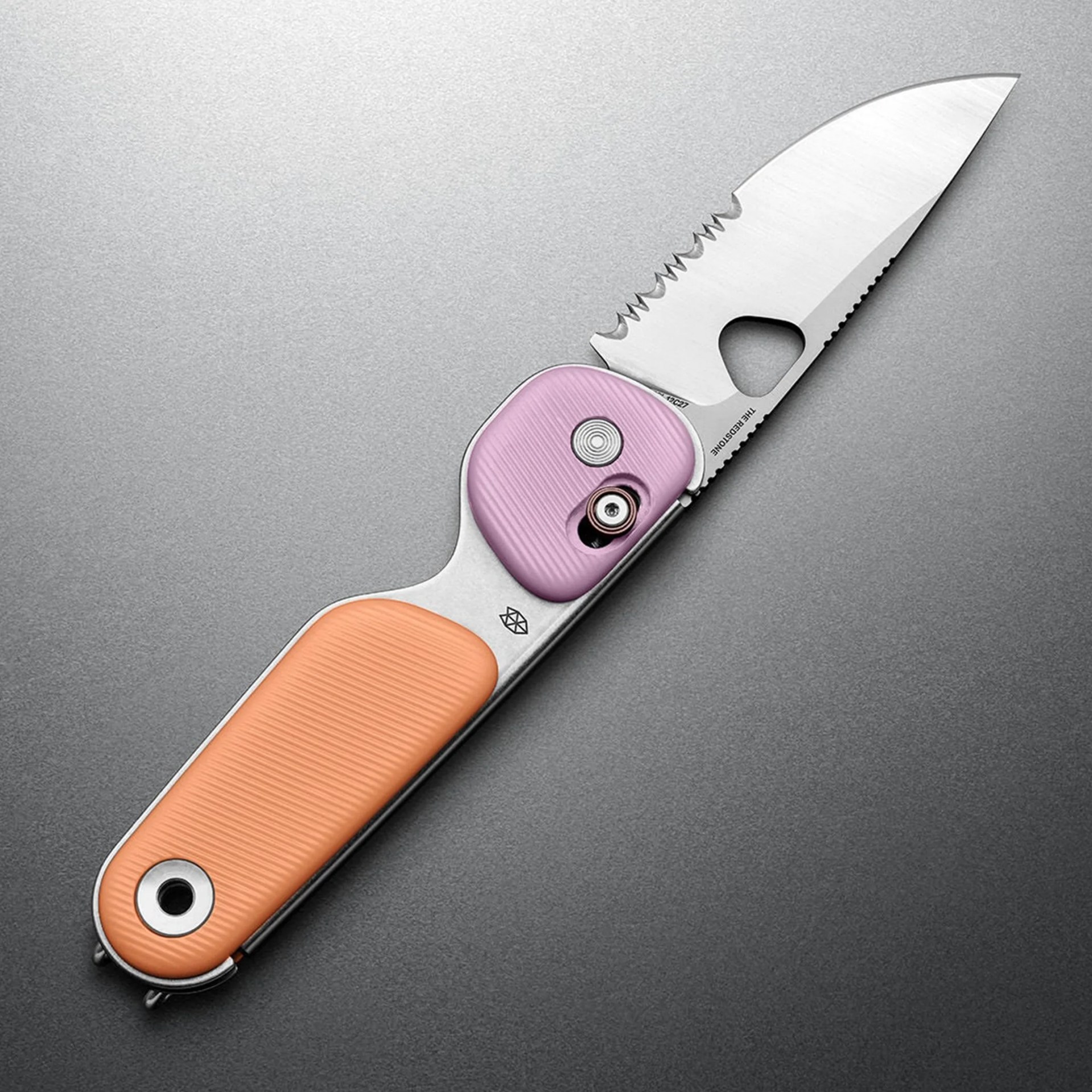 Folding knife with a partially serrated stainless steel blade and a handle featuring orange and purple textured grips.